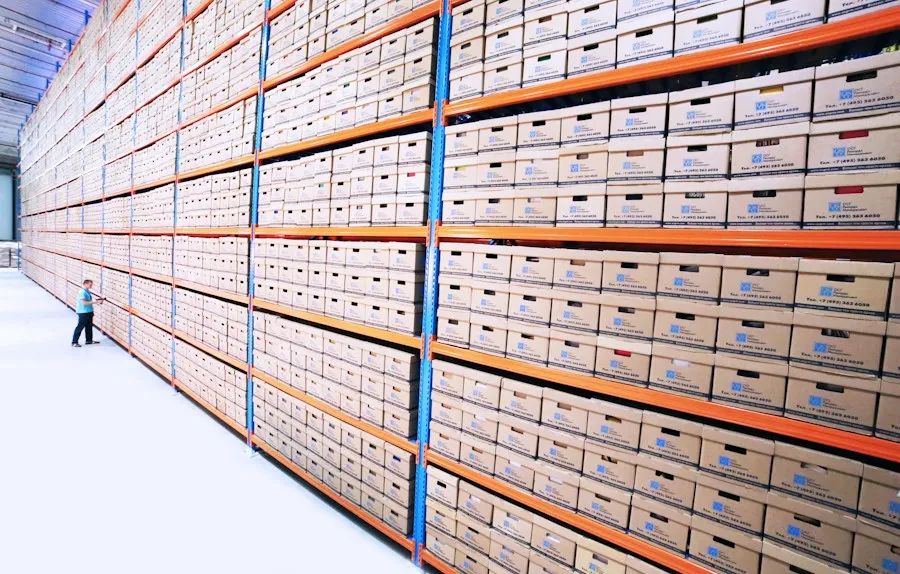 Long warehouse aisle of boxed inventory