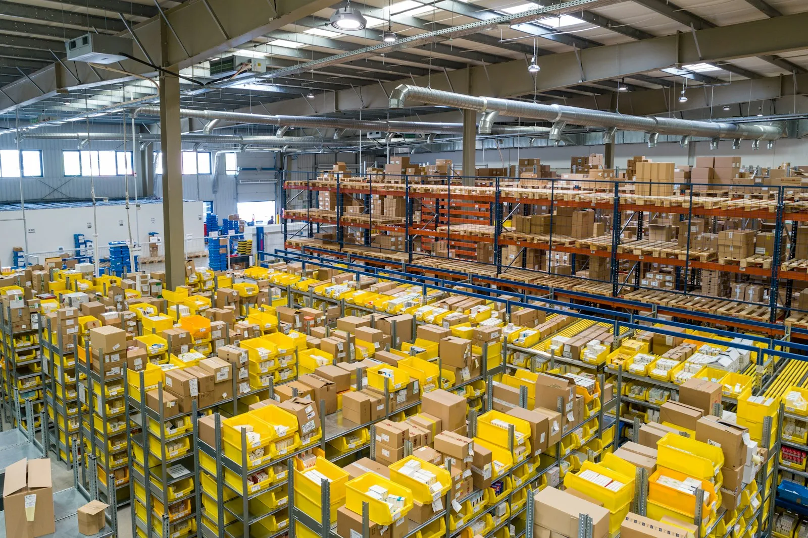Bright warehouse with pallets of boxed merchandise